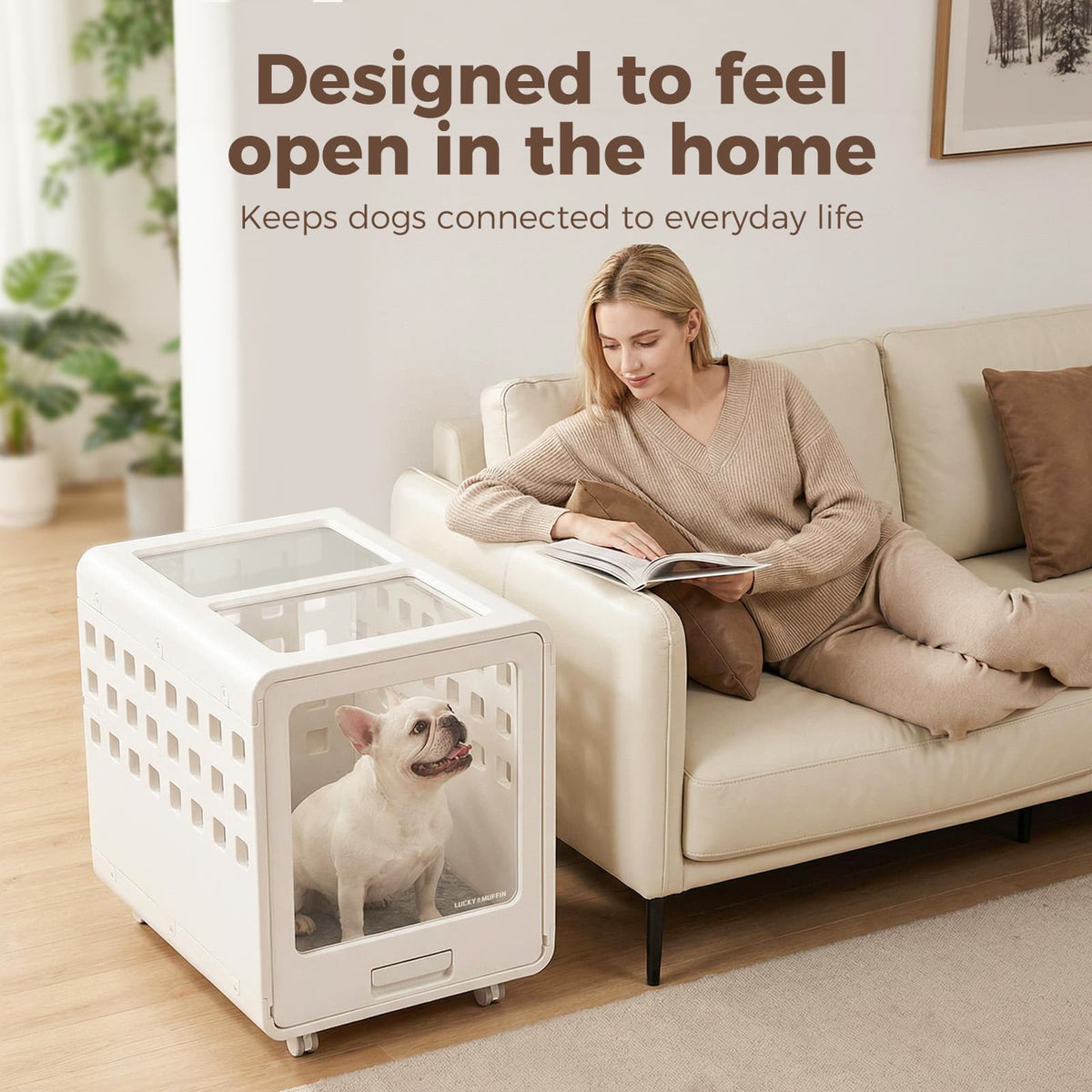 Woman reading a book on a couch next to a white pet crate with a dog inside, in a home setting.