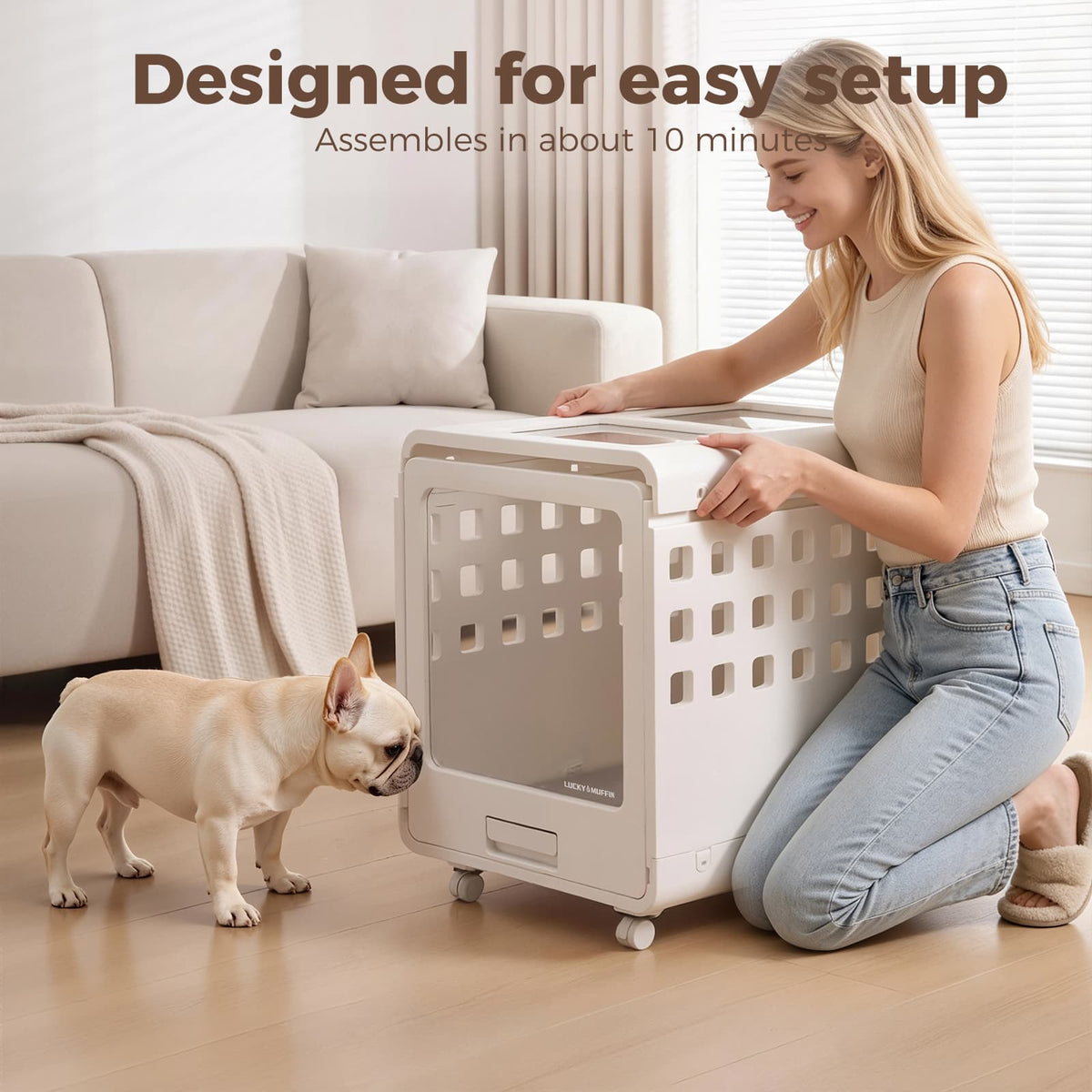 Woman assembling a pet crate in a living room with a dog nearby